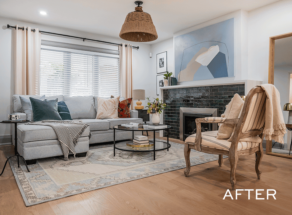 Cozy living room with a sectional sofa, patterned rug, accent chair, and a modern fireplace