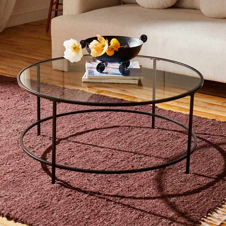Oval coffee table made of brass, glass top, for living room