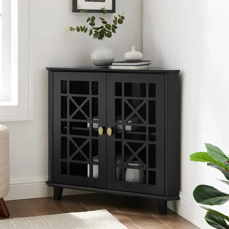 Black corner cabinet with glass doors and gold-toned hardware