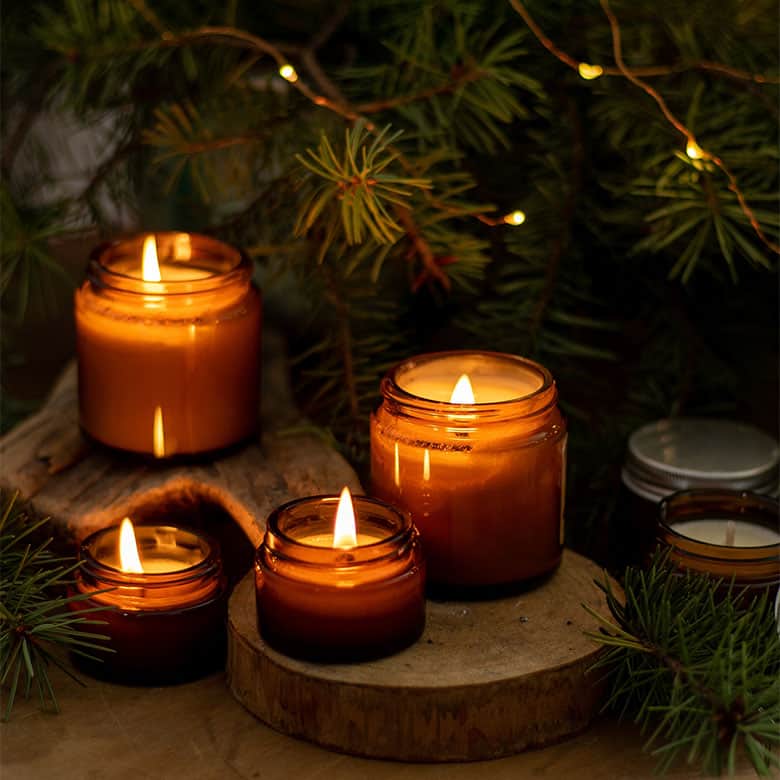 candles around holiday tree