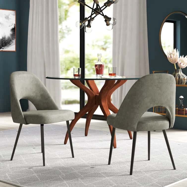 Gray dining chairs around a table