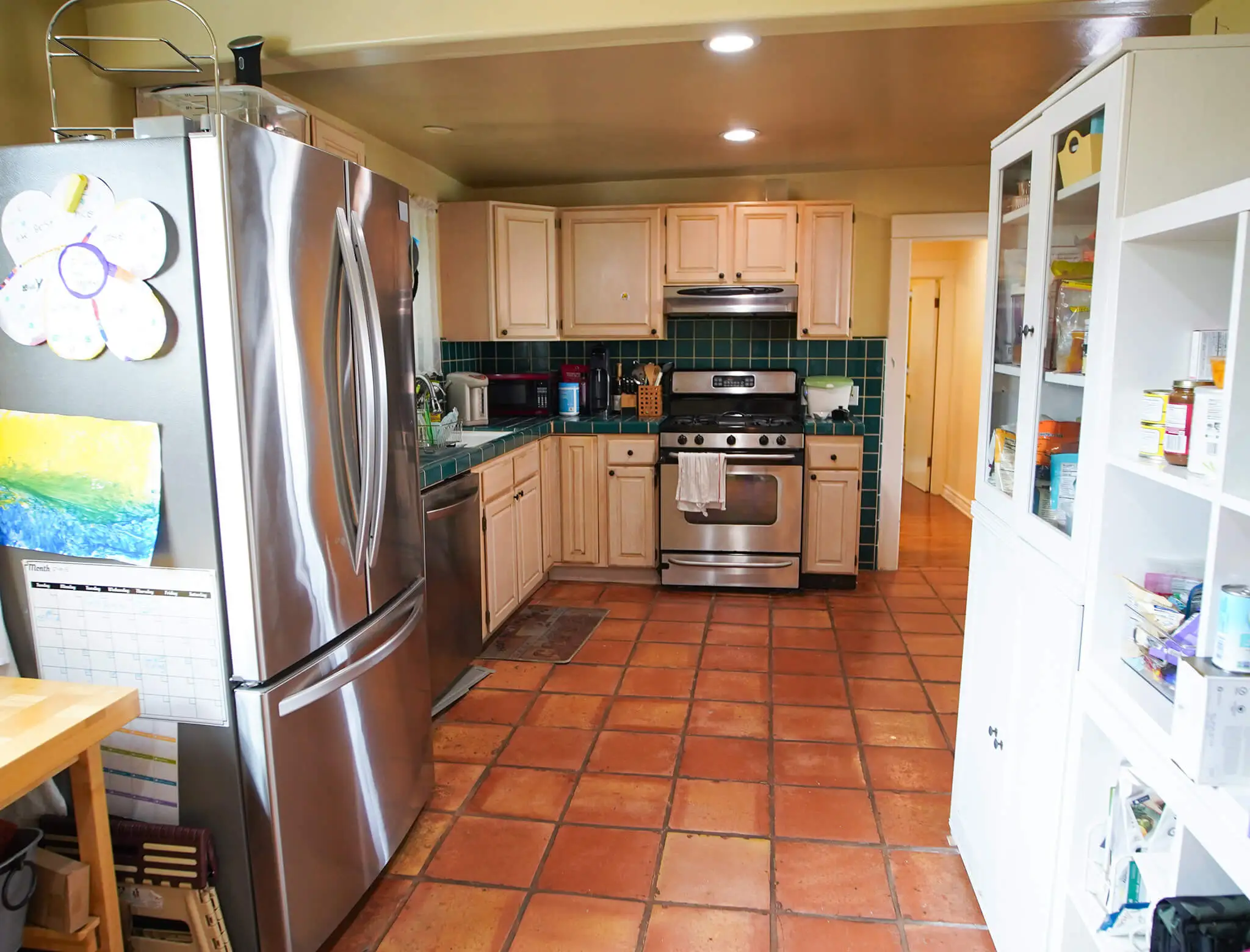 old and outdated kitchen with terracotta floors