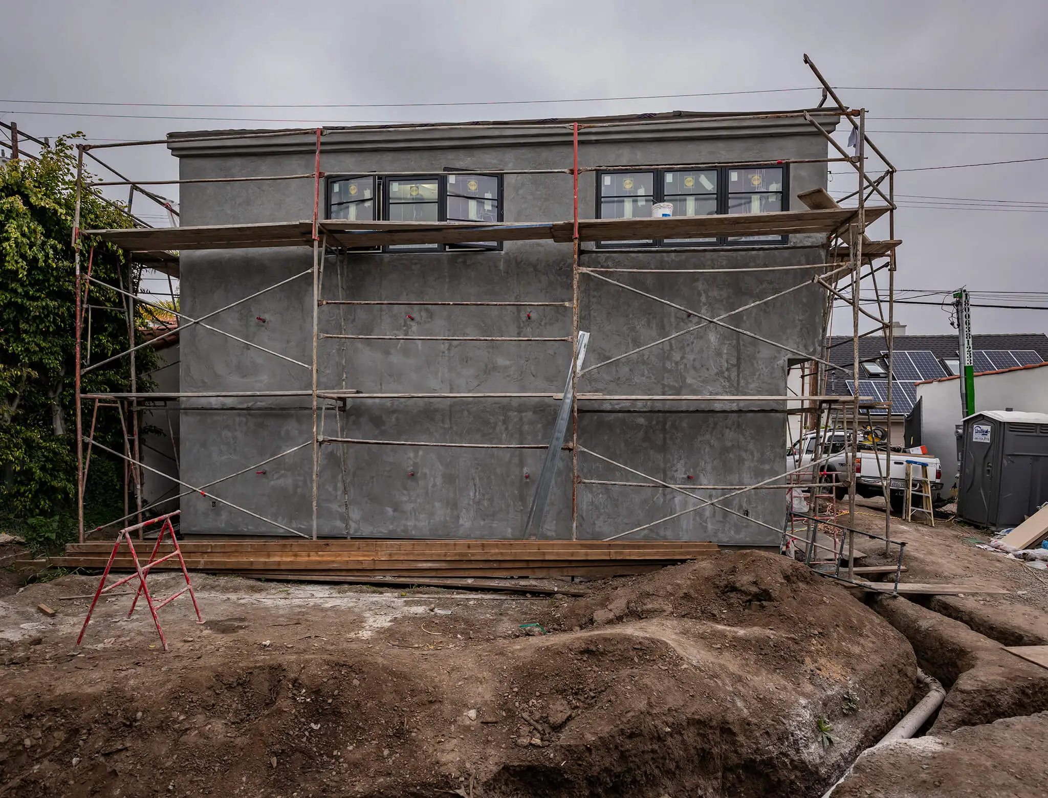 run-down detached garage in middle of construction