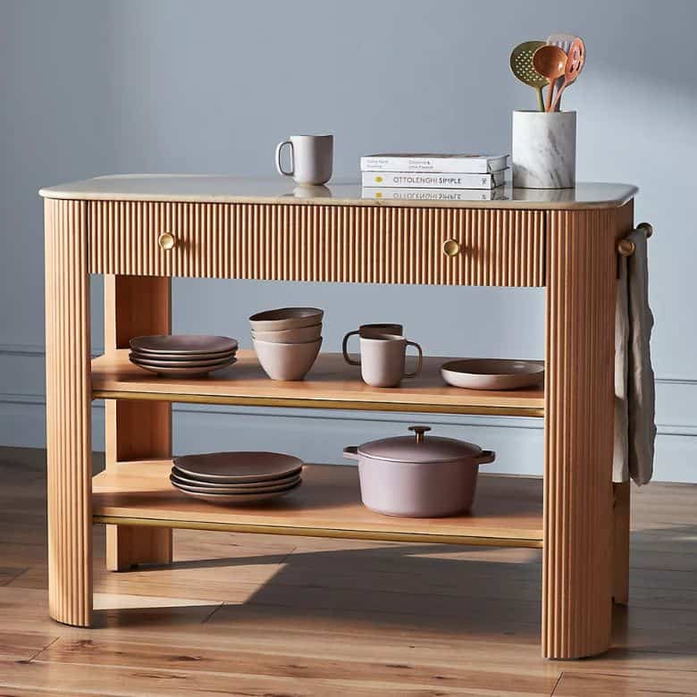 fluted wooden kitchen island with white marble top