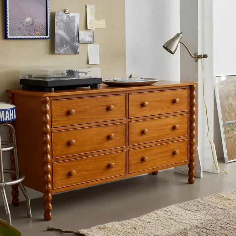 wooden dresser with accented legs