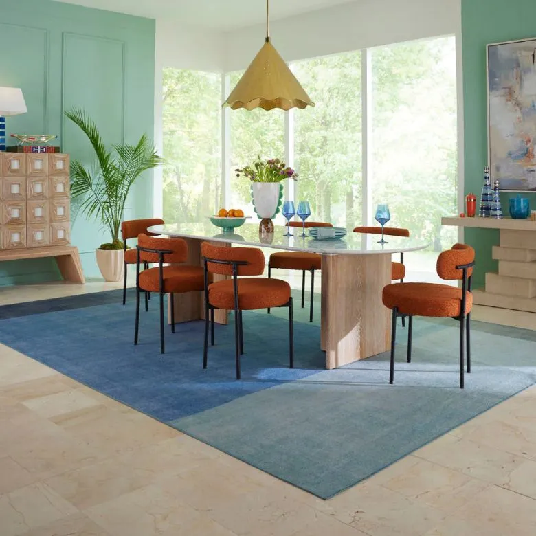 blue colorblocked area rug in dining room