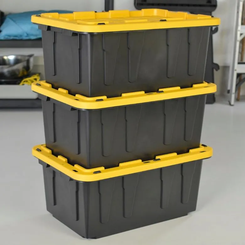 black stackable storage bins with yellow lids